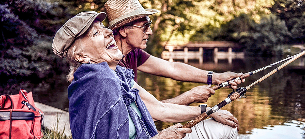 older couple fishing in the woods